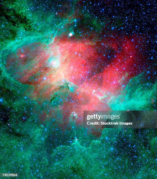 this majestic view taken by nasa's spitzer space telescope tells an untold story of life and death in the eagle nebula, an industrious star-making factory located 7,000 light-years away in the serpens constellation. - nebulosa del águila fotografías e imágenes de stock