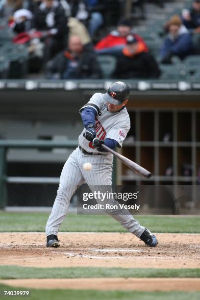 Nick Punto of the Minnesota Twins bats during the game against the Chicago White Sox at U.S. Cellular Field in Chicago, Illinois on April 7, 2007....