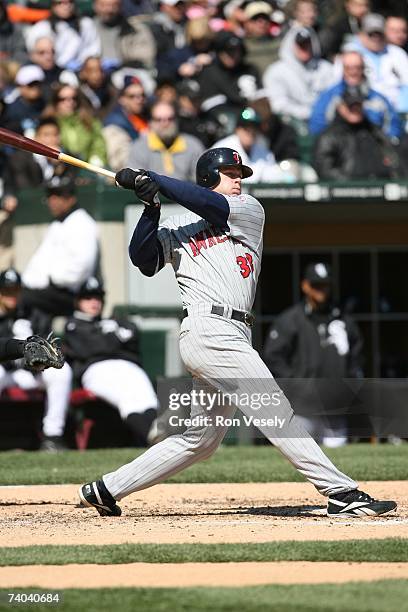 Justin Morneau of the Minnesota Twins bats during the game against the Chicago White Sox at U.S. Cellular Field in Chicago, Illinois on April 8,...