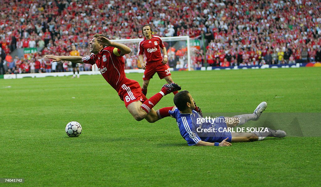 Liverpool'sSteven Gerrard (L) is brought...