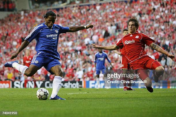 Daniel Agger of Liverpool attepmts to block the shot from Didier Drogba of Chelsea during the UEFA Champions League semi final second leg match...