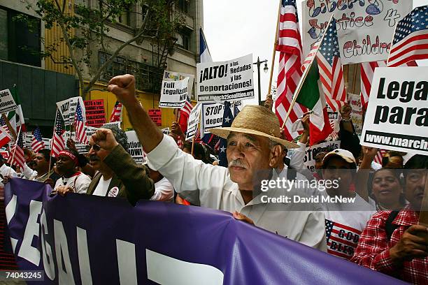 Demonstrators march to City Hall in one of several May Day marches and rallies in southern California and in at least 75 cities nationwide to press...