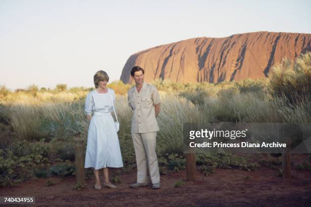 Diana Princess of Wales and Prince Charles pose in front of Uluru/Ayers Rock near Alice Springs, Australia during the Royal Tour of Australia, 21st...