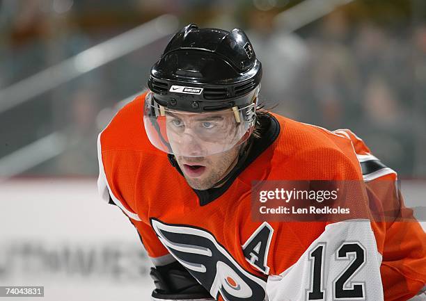 Simon Gagne of the Philadelphia Flyers lines up in position prior to the faceoff against the Buffalo Sabres during their NHL game at Wachovia Center...