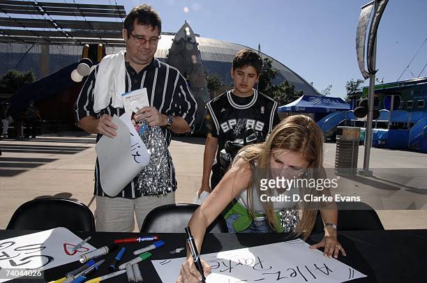 San Antonio Spurs fans create signs before the game against the Denver Nuggets in Game Two of the Western Conference Quarterfinals during the 2007...
