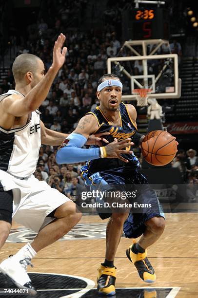 Allen Iverson of the Denver Nuggets drives against Tony Parker of the San Antonio Spurs in Game Two of the Western Conference Quarterfinals during...