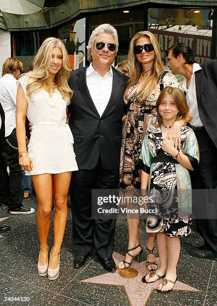 Producer John Peters poses wife Mindy and his daughters Caleigh and Kendyl at the ceremony honoring him with a star on the Hollywood Walk of Fame May...