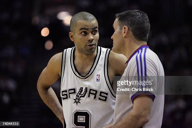 Tony Parker of the San Antonio Spurs talks to referee Monty McCutchen during the game against the Denver Nuggets in Game Two of the Western...