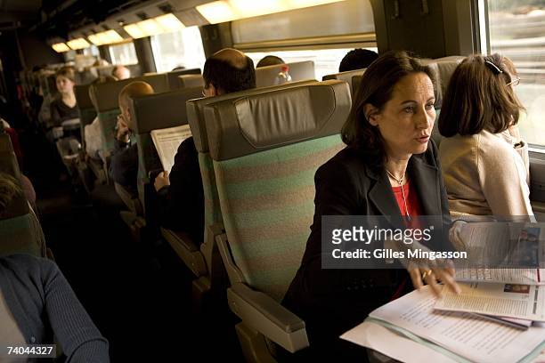 French PS presidential candidate Segolene Royal speaks with campaign director Francois Rebsamen and spokeperson Vincent Peillon during a TGV train...