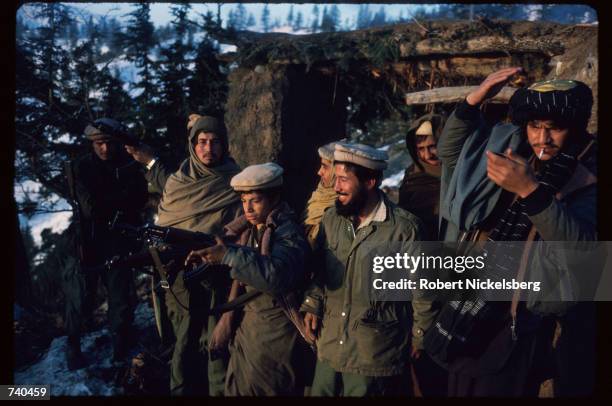 Guerrilla soldiers stand at a remote base in the Safed Koh Mountains February 10, 1988 in Afghanistan. A Soviet-supported communist coup by the...