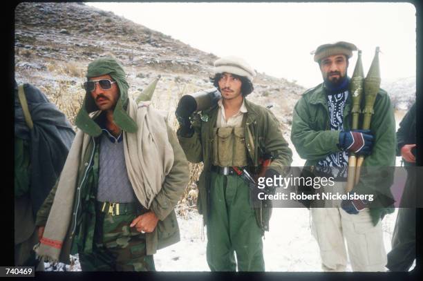 Guerrilla soldiers carry artillery to the front from a remote base in the Safed Koh Mountains February 10, 1988 in Afghanistan. A Soviet-supported...