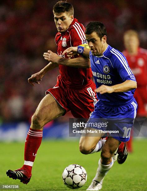 Steven Gerrard of Liverpool battles with Joe Cole of Chelsea during the UEFA Champions League semi final second leg match between Liverpool and...