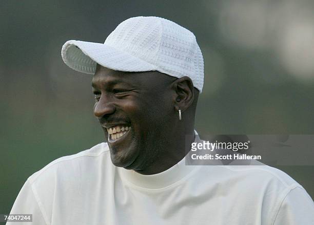 Basketball star Michael Jordan laughs on the first tee during the pro-am at the Wachovia Championship at Quail Hollow Country Club on May 2, 2007 in...