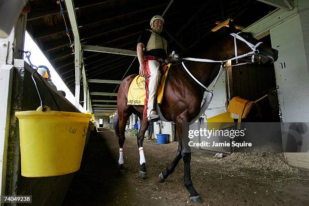 Kentucky Derby contender Hard Spun, with trainer Larry Jones aboard, walks in his barn during morning workouts for the 133rd Kentucky Derby on May 2,...