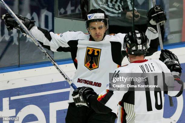 Germany's Michael Hackert and Michael Wolf celebrate after scoring during the IIHF World Ice Hockey Championship preliminary round, group C match...