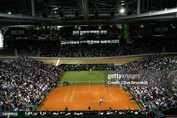 Rafael Nadal of Spain in action against Roger Federer of Switzerland during the 'The Battle of the Surfaces' at The Palma Arena on May 2, 2007 in...