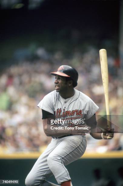 Outfielder Frank Robinson of the Baltimore Orioles watches the ball he's just hit during a game in July, 1971 against the Cleveland Indians at...
