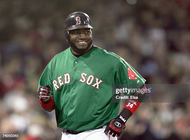 David Ortiz of the Boston Red Sox smiles as he jogs against the New York Yankees on April 20, 2007 at Fenway Park in Boston, Massachusetts.