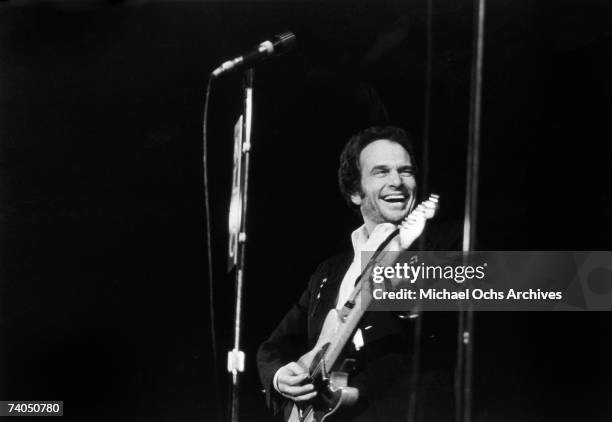 Country musician Merle Haggard performs on stage during a mid 1970's concert.