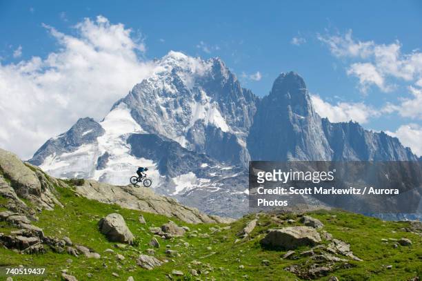man biking in mountains of la flegere - mont blanc massiv stock-fotos und bilder