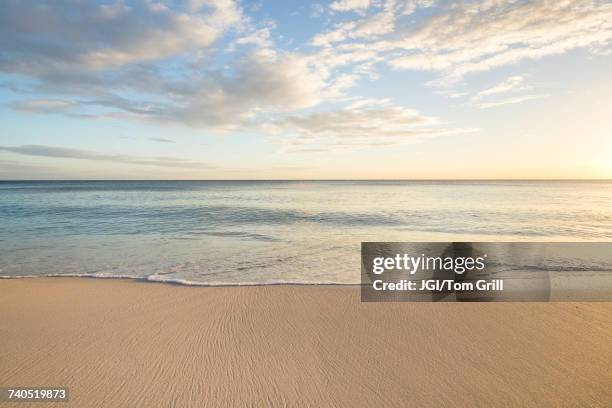 ocean wave on beach - beach sunset stockfoto's en -beelden