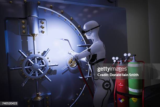 robot woman using blowtorch on vault door - biotechnology investment stock pictures, royalty-free photos & images