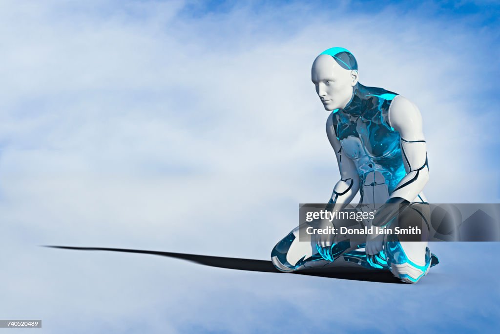 Robot man kneeling on ground