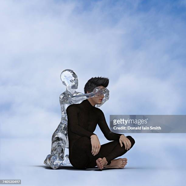 robot woman covering eyes of sitting man - android stock pictures, royalty-free photos & images