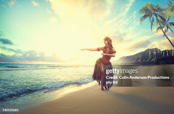 pacific islander woman hula dancing on beach - hula dancing stock pictures, royalty-free photos & images