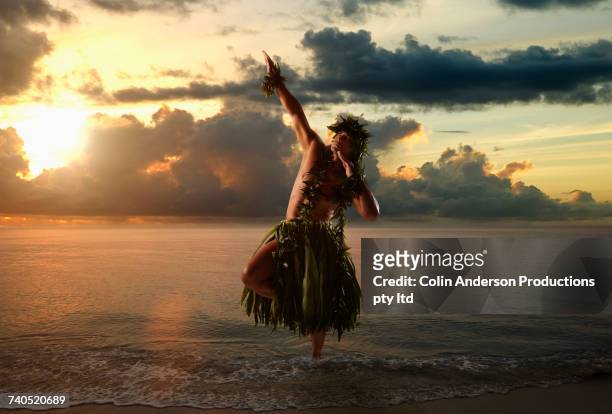 hawaiian man hula dancing on beach - men in loincloths stock pictures, royalty-free photos & images