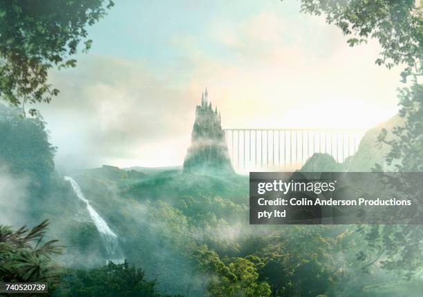 distant castle near waterfall - fairy tale stock-fotos und bilder