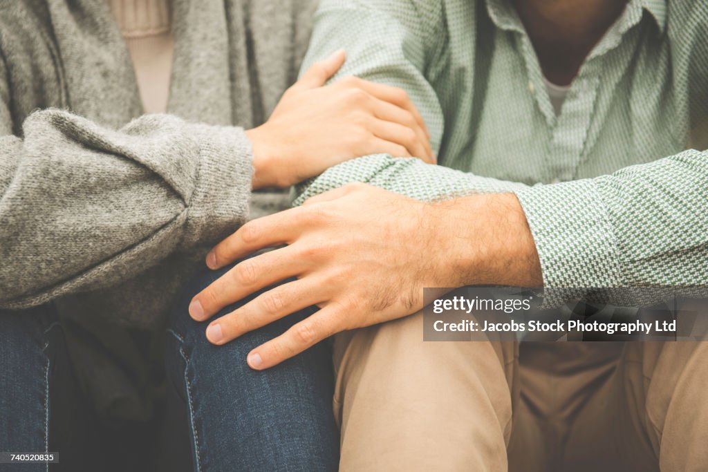 Caucasian couple sitting together