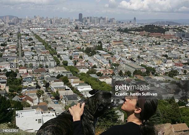 Christine Ponelle gets a kiss from her dog Cholla at Bernal Heights Park May 2, 2007 in San Francisco, California. The Humane Society of the United...