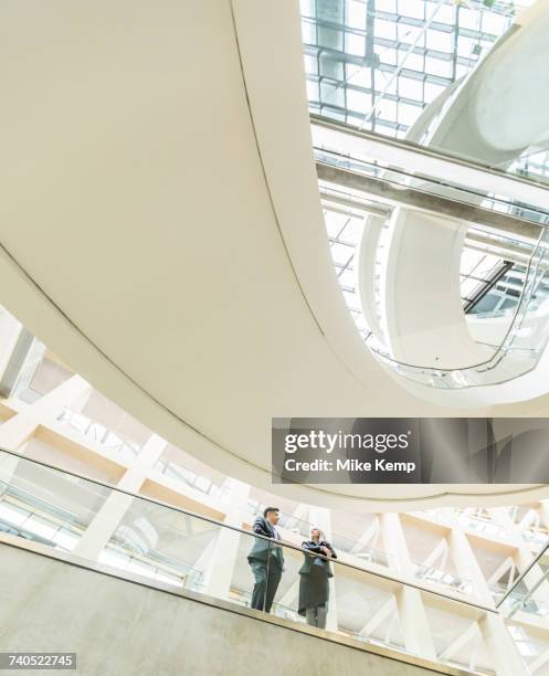business people talking in lobby - salt lake city people stock pictures, royalty-free photos & images