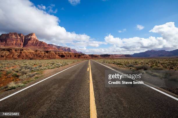 road to distant desert landscape - flagstaff arizona stock pictures, royalty-free photos & images