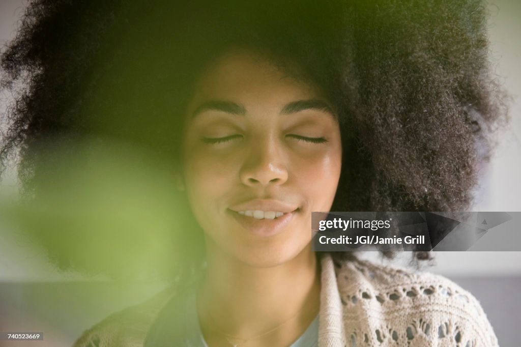 Portrait of African American woman with eyes closed