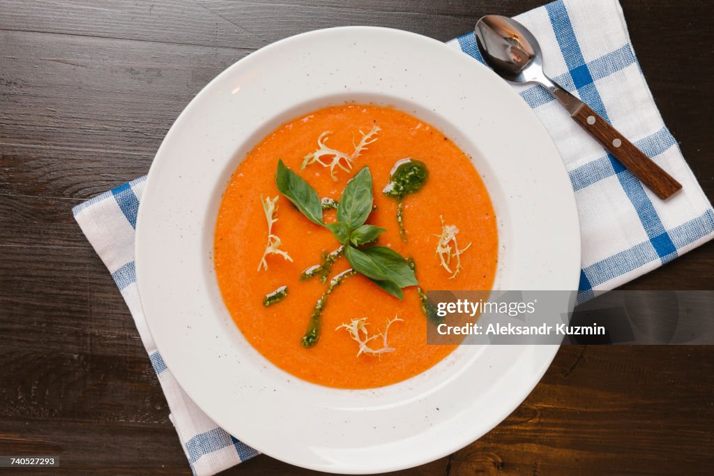 Basil in bowl of tomato soup