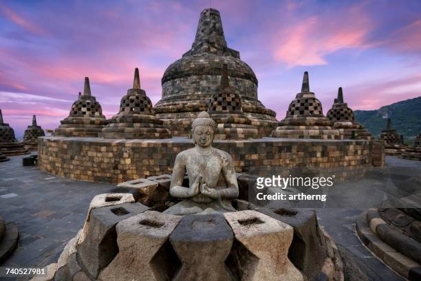 buddha statue at borobudur, magelang, yogyakarta, central java, indonesia - yogyakarta stockfoto's en -beelden