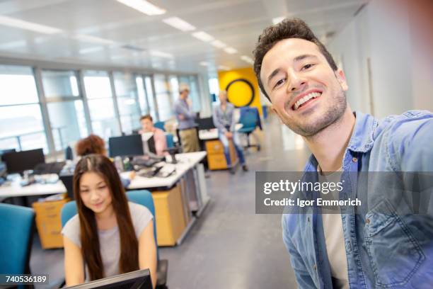 male digital designer taking selfie in office - digital techniques ストックフォトと画像