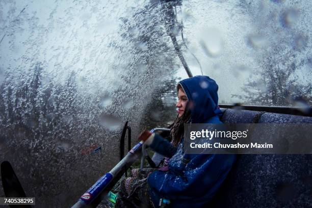 young female hiker in chairlift during mountain snowstorm - woman looking through ice stock pictures, royalty-free photos & images