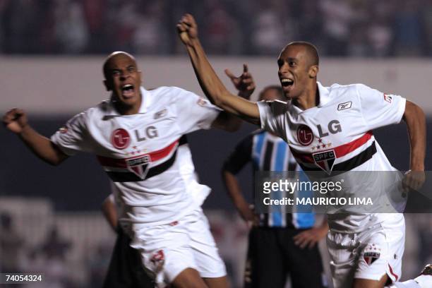Miranda , of Sao Paulo FC, celebrates his goal against Gremio followed by teammate Alex Silva during their Libertadores Cup football match between...