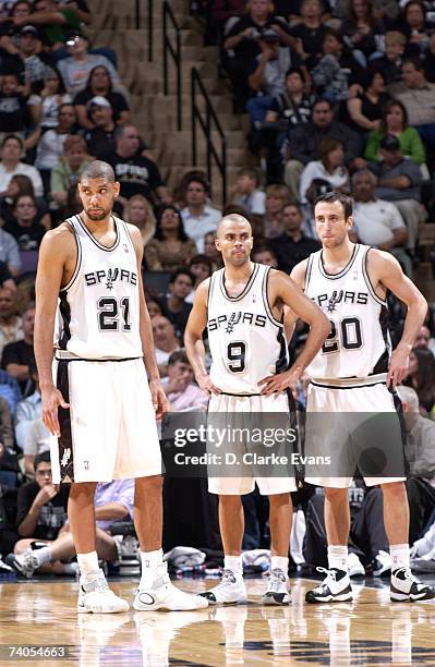Tim Duncan, Tony Parker, and Manu Ginobili of the San Antonio Spurs stand while facing the Denver Nuggets in Game Five of the Western Conference...