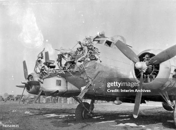 View of the extensive damage sustained on the nose of a B-17 Flying Fortress after being shot up by anti-aircraft artillery during bombing runs over...