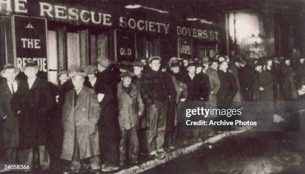 Bread line forms outside the Rescue Society in Doyers Street, New York City, during the Great Depression, 1929.