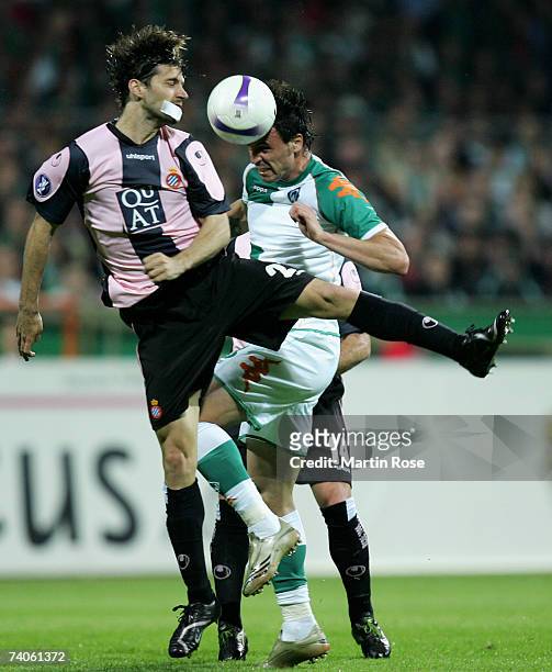 Daniel Jarque of Espanyol and Hugo Almeida of Bremen go up for a header during the UEFA Cup semi-final, 2nd leg match between Werder Bremen and...