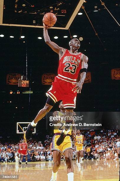 Michael Jordan of the Chicago Bulls goes for a dunk against the Los Angeles Lakers in game five of the 1991 NBA Finals on June 12, 1991 at the Great...