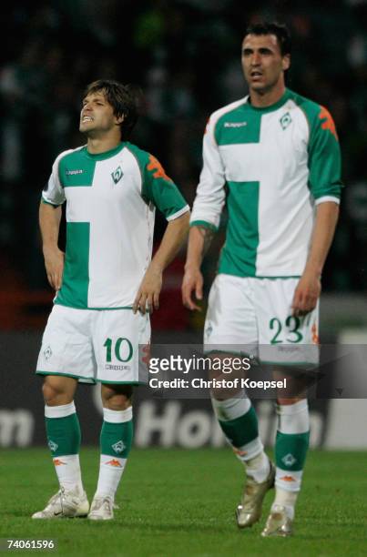 Diego and Hugo Almeida of Bremen look disappointed after Espynol scored the second goal during the UEFA Cup Semi-Final, second Leg match between...