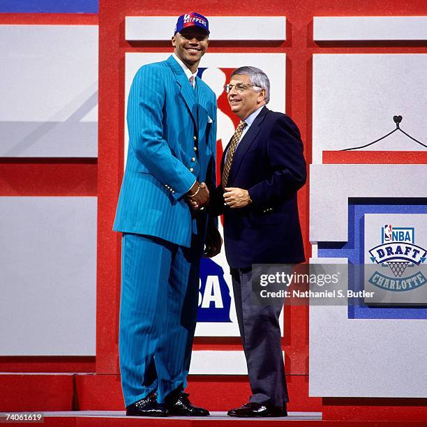 Maurice Taylor drafted by the Los Angeles Clippers shakes NBA Commissioner David Stern's hand during the 1997 NBA Draft on June 25, 1997 at the...