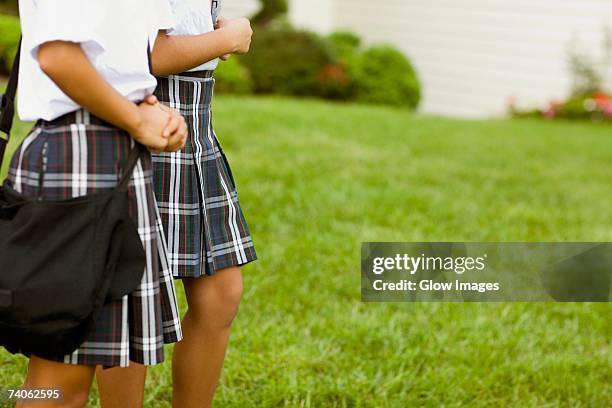 mid section view of two schoolgirls walking - ankle length stock pictures, royalty-free photos & images