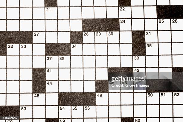 close-up of a crossword puzzle - kruiswoordpuzzel stockfoto's en -beelden